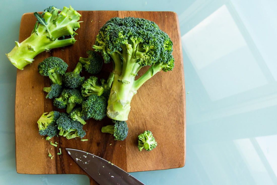 Broccoli on a wooden cutting board